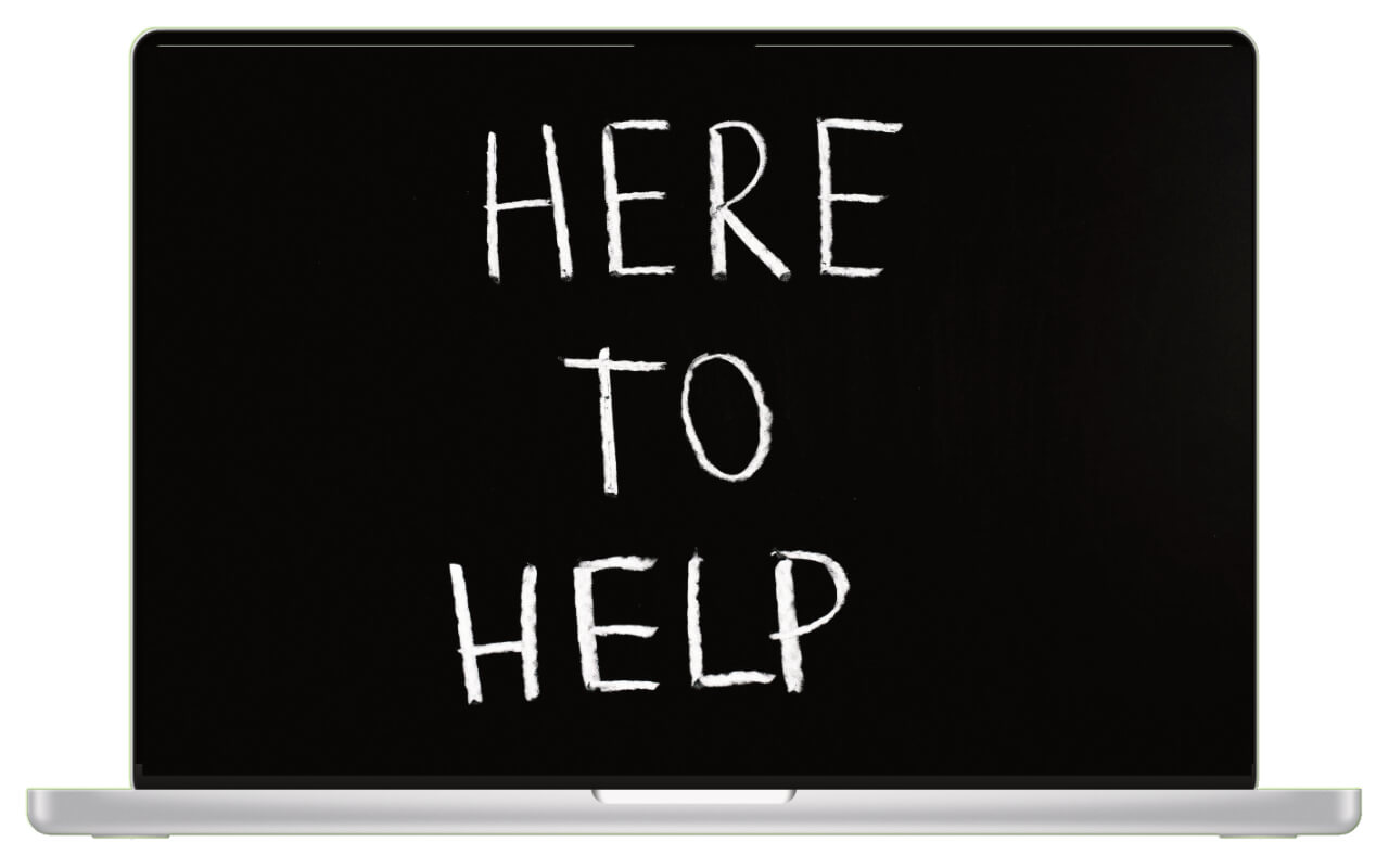 A laptop on a plain background shows the message on screen "Here to Help!"